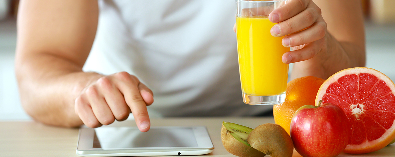 Man counting calories on tablet